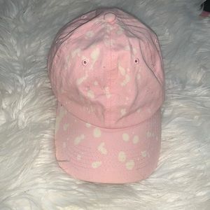 Pink and white baseball cap
